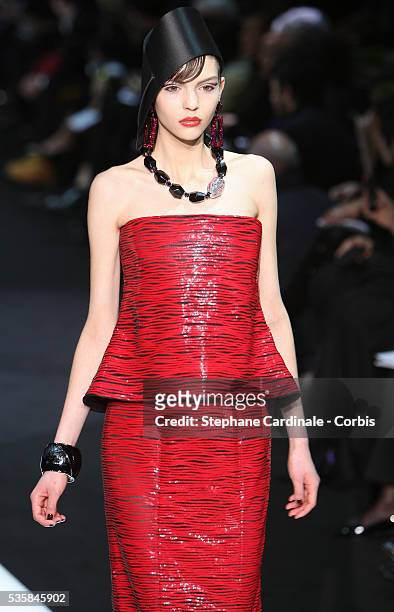 Model walks the runway during the Giorgio Armani Prive Spring/Summer 2013 Haute-Couture show, in Paris.