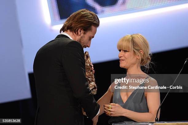 Matthias Schoenaerts receives the Best Young Actor Cesar for 'De rouille et d'os' by Marina Fois during the Cesar Awards Ceremony 2013 at Theatre du...