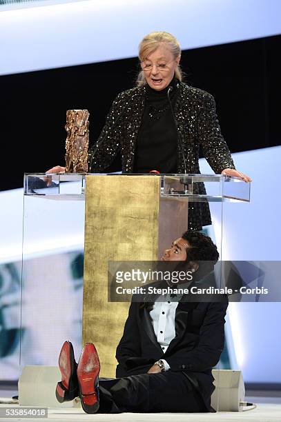Margaret Menegoz receives the Best Film Cesar for 'Amour' on behalf of Michael Haneke next to Jamel Debbouze during the Cesar Awards Ceremony 2013 at...