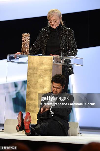 Margaret Menegoz receives the Best Film Cesar for 'Amour' on behalf of Michael Haneke next to Jamel Debbouze during the Cesar Awards Ceremony 2013 at...