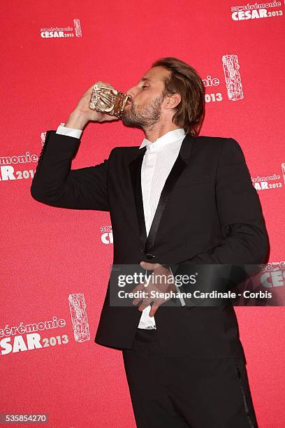 Matthias Schoenaerts poses with his trophy after receiving the Best Newcomer Actor award during the Cesar Film Awards 2013 at Theatre du Chatelet, in...