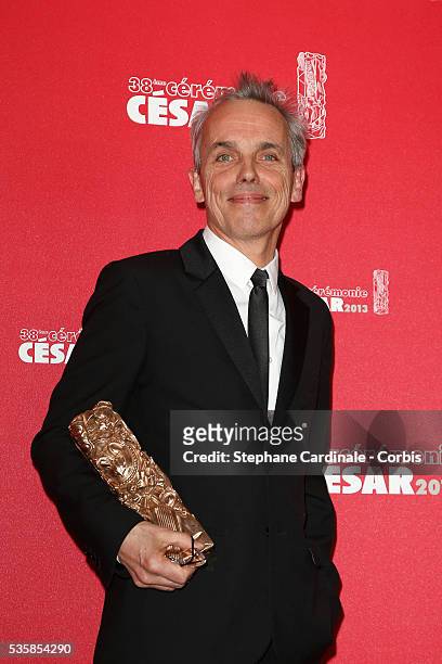Romain Winding poses with his trophy after winning the Best Photography award during the Cesar Film Awards 2013 at Theatre du Chatelet, in Paris.