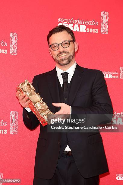 Cyril Mennegun poses with his trophy after receiving the Best Fisrt Movie award during the Cesar Film Awards 2013 at Theatre du Chatelet, in Paris.