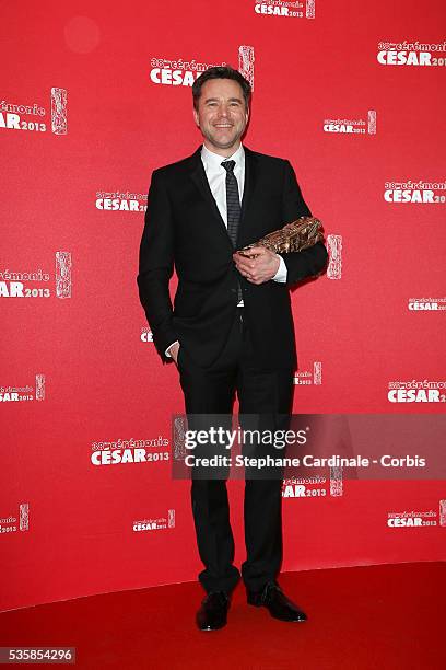French actor Guillaume de Tonquedec poses with his trophy after receiving the Best Supporting Actor award during the Cesar Film Awards 2013 at...