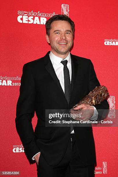 French actor Guillaume de Tonquedec poses with his trophy after receiving the Best Supporting Actor award during the Cesar Film Awards 2013 at...