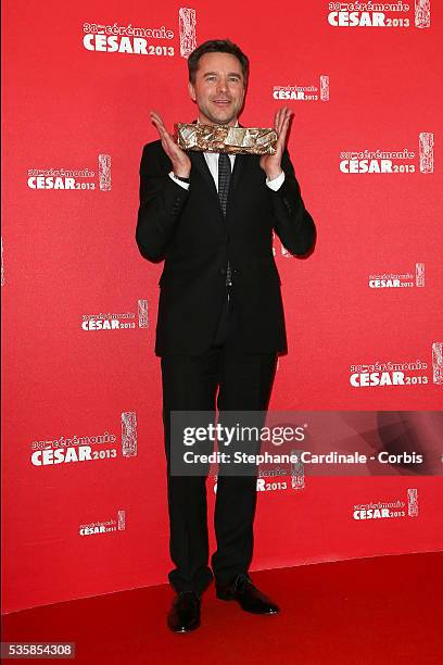 French actor Guillaume de Tonquedec poses with his trophy after receiving the Best Supporting Actor award during the Cesar Film Awards 2013 at...