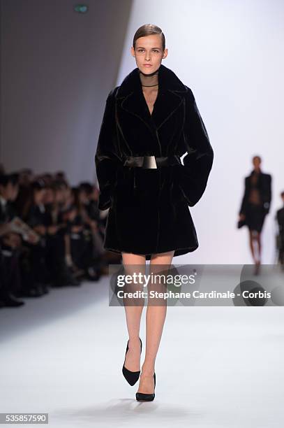 Model walks the runway during Akris Fall/Winter 2013/14 Ready-to-Wear show as part of Paris Fashion Week, in Paris.