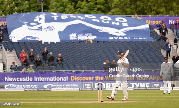 England captain Alastair Cook salutes the crowd after reaching 10,000 test runs during day four of the 2nd Investec Test match between England and...