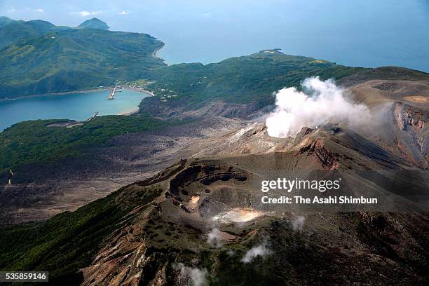 In this aerial image, volcanic smoke continue to spew from Mount Shindake of Kuchinoerabujima Island on May 26, 2016 in Yakushima, Kagoshima, Japan....