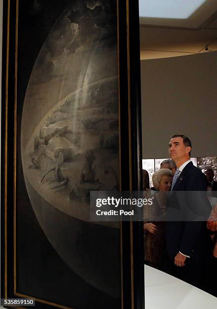King Felipe of Spain views "The Garden of Earthly Delights" by Hieronymus Bosch during a visit to the 'El Bosco' 5th Centenary Anniversary Exhibition...