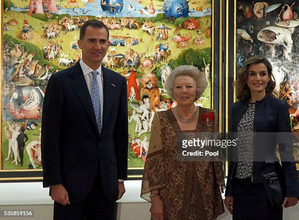 King Felipe of Spain , Queen Letizia of Spain and Beatrix of the Netherlands stand in front of "The Garden of Earthly Delights" by Hieronymus...