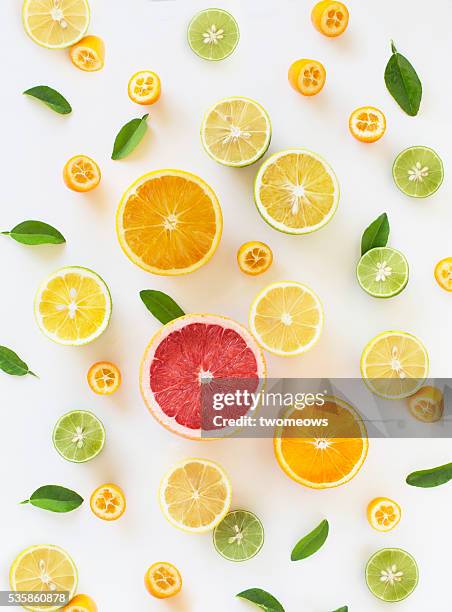 fresh citrus fruit slice design pattern background. - fad diet stock pictures, royalty-free photos & images