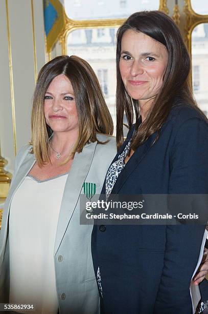 Anne-Charlotte Valandrey poses with French Culture Minister Aurelie Filippetti after being honored 'Chevalier De L'Ordre Des Arts Et Des Lettres', at...