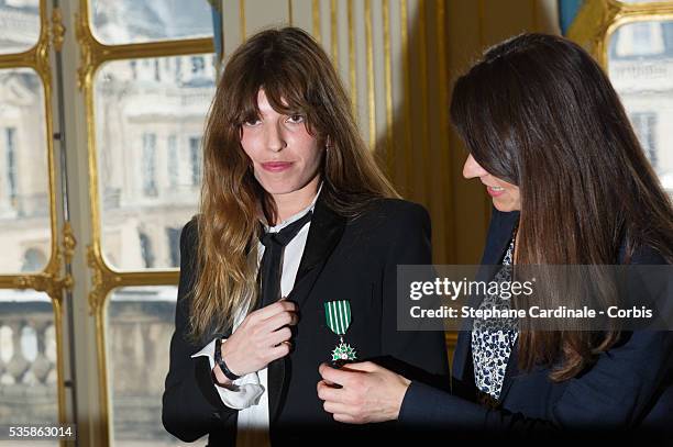 Lou Doillon poses after being honored 'Chevalier De L'Ordre Des Arts Et Des Lettres' by French Culture Minister Aurelie Filippetti , at Ministere de...