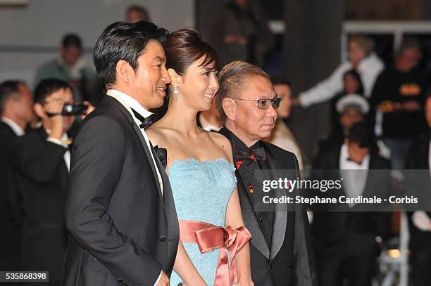 Actor Takashi Miike, actress Nanako Matsushima and Director Takao Osawa attend the 'Wara No Tate' premiere during the 66th Cannes International Film...