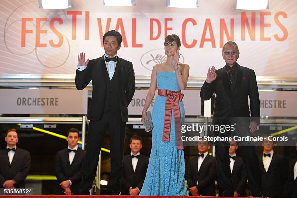 Actor Takashi Miike, actress Nanako Matsushima and director Takao Osawa attend the 'Wara No Tate' premiere during the 66th Cannes International Film...