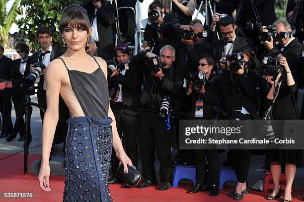 Milla Jovovich attends the 'Behind The Candelabra' premiere during the 66th Cannes International Film Festival.