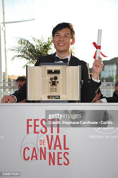 Director Anthony Chen poses with the 'Camera d'Or' for Best First Film at the 'Palme D'Or Winners Photocall' during the 66th Cannes International...
