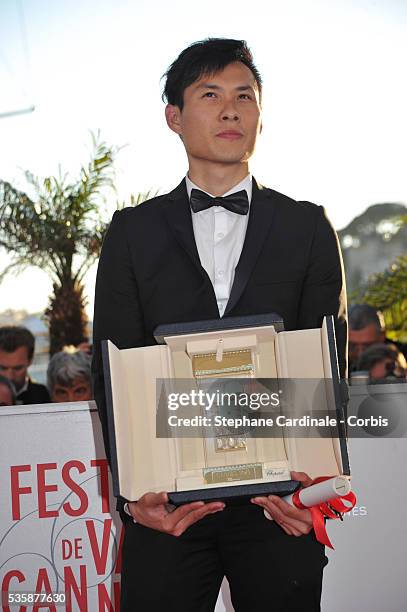 Director Anthony Chen poses with the 'Camera d'Or' for Best First Film at the 'Palme D'Or Winners Photocall' during the 66th Cannes International...