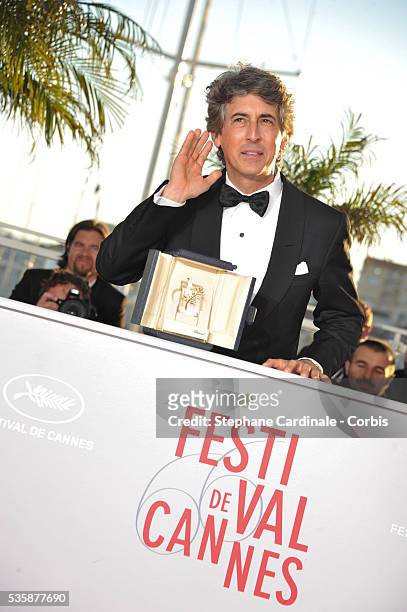 Director of 'Nebraska' Alexander Payne poses with the 'Prix D'Interpretation Masculine' which he received on behalf of Bruce Dern attends the 'Palme...