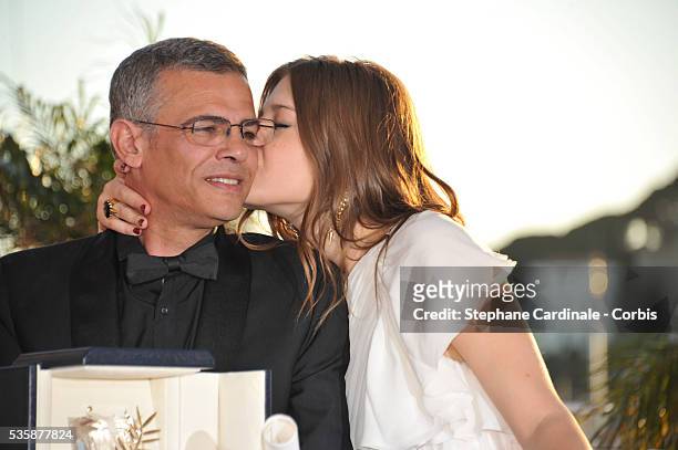 Director Abdellatif Kechiche and Adele Exarchopoulos pose with the 'Palme d'Or' for 'La Vie D'adele' at the 'Palme D'Or Winners Photocall' during the...