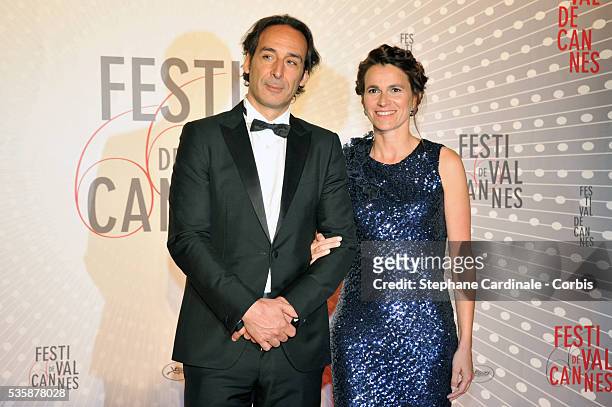 Composer Alexandre Desplat and french culture minister Aurelie Filippetti attend the 'Palme D'Or Winners dinner' during the 66th Cannes International...