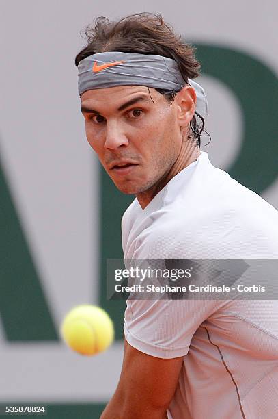 Rafael Nadal of Spain plays a backhand in his Men's Singles match against Fabio Fognini of Italy during day seven of the French Open at Roland Garros...