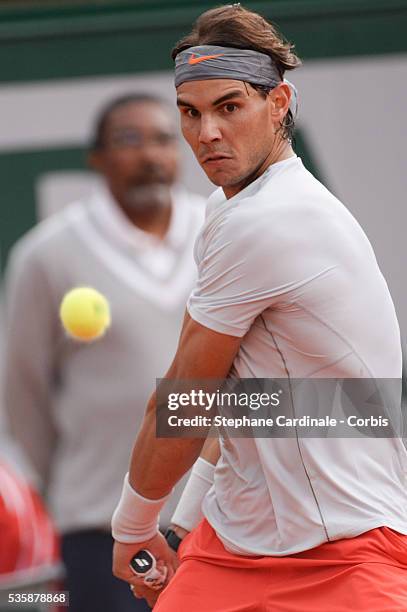 Rafael Nadal of Spain plays a backhand in his Men's Singles match against Fabio Fognini of Italy during day seven of the French Open at Roland Garros...