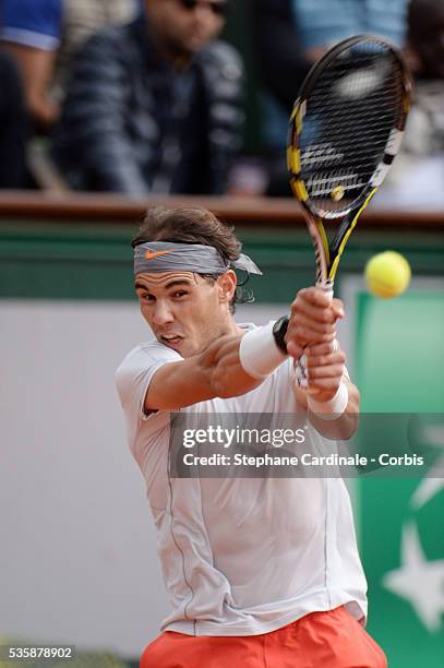 Rafael Nadal of Spain plays a backhand in his Men's Singles match against Fabio Fognini of Italy during day seven of the French Open at Roland Garros...