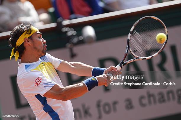 Fabio Fognini of Italy plays a forehand in his Men's Singles match against Rafael Nadal of Spain during day seven of the French Open at Roland Garros...