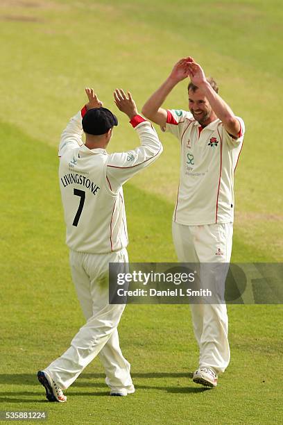 Liam Livingstone of Lanchashire celebrates with Tom Smith after the dismissal Alex Lees of Yorkshire during day two of the Specsavers County...