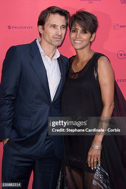 Olivier Martinez and Halle Berry attend the 'Toiles Enchantees' Red Carpet as part of the Champs Elysees Film Festival 2013 at Publicis Champs...