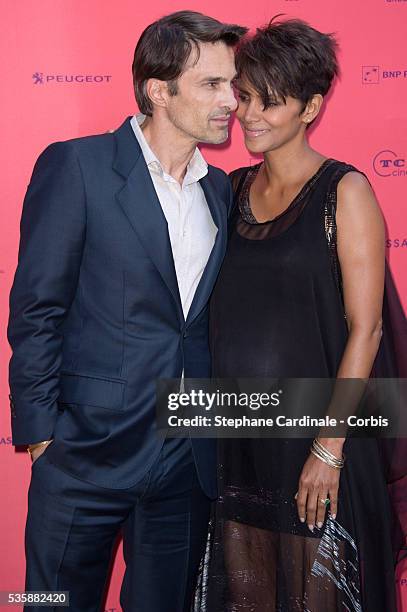 Olivier Martinez and Halle Berry attend the 'Toiles Enchantees' Red Carpet as part of the Champs Elysees Film Festival 2013 at Publicis Champs...