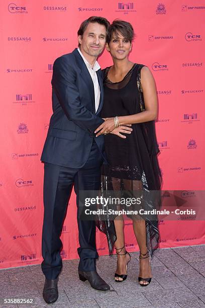 Olivier Martinez and Halle Berry attend the 'Toiles Enchantees' Red Carpet as part of the Champs Elysees Film Festival 2013 at Publicis Champs...