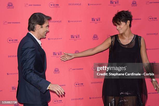 Olivier Martinez and Halle Berry attend the 'Toiles Enchantees' Red Carpet as part of the Champs Elysees Film Festival 2013 at Publicis Champs...