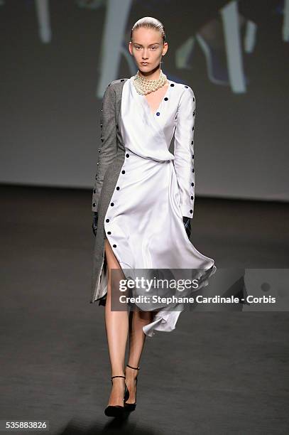 Model walks the runway during Christian Dior show as part of Paris Fashion Week Haute-Couture Fall/Winter 2013-2014, in Paris.