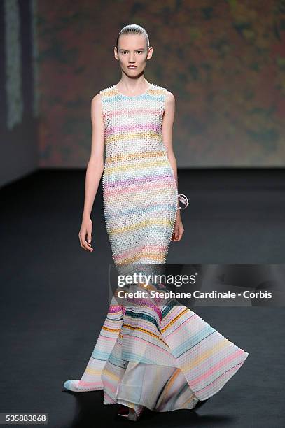 Model walks the runway during Christian Dior show as part of Paris Fashion Week Haute-Couture Fall/Winter 2013-2014, in Paris.