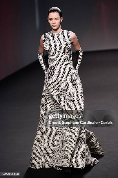 Model walks the runway during Christian Dior show as part of Paris Fashion Week Haute-Couture Fall/Winter 2013-2014, in Paris.