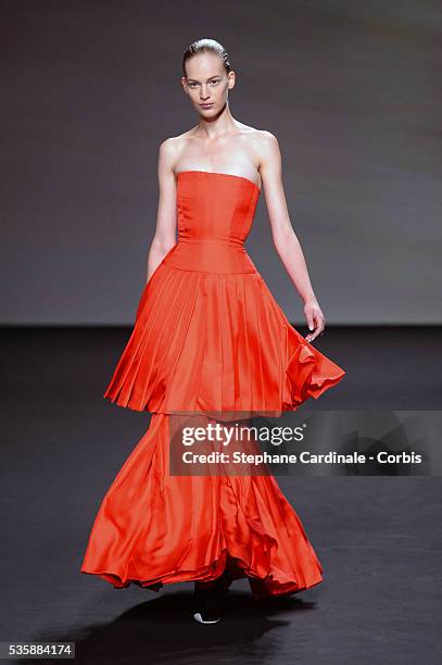 Model walks the runway during Christian Dior show as part of Paris Fashion Week Haute-Couture Fall/Winter 2013-2014, in Paris.