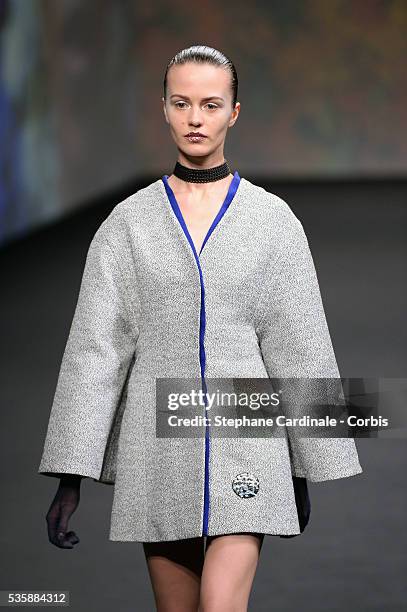 Model walks the runway during Christian Dior show as part of Paris Fashion Week Haute-Couture Fall/Winter 2013-2014, in Paris.