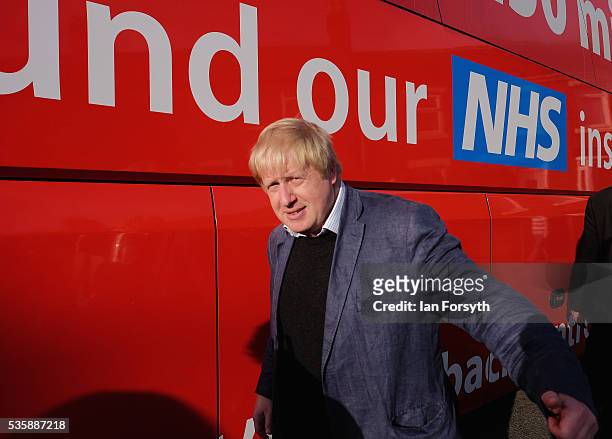 Boris Johnson MP walks past the battle bus during a visit Chester-Le-Street Cricket Club as part of the Brexit tour on May 30, 2016 in...