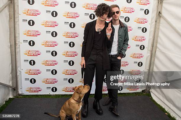 Matthew Healy and Adam Hann backstage at Powderham Castle on May 29, 2016 in Exeter, England.