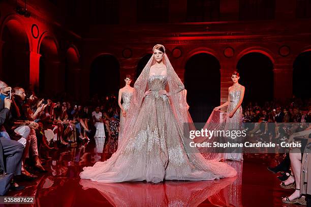 Models walk the runway during the Elie Saab show as part of Paris Fashion Week Haute-Couture Fall/Winter 2013-2014 at Palais Brongniart on July 3 in...