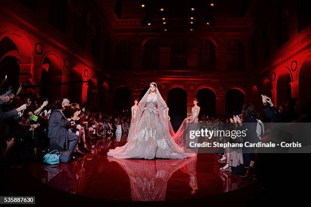 Models walk the runway during the Elie Saab show as part of Paris Fashion Week Haute-Couture Fall/Winter 2013-2014 at Palais Brongniart on July 3 in...