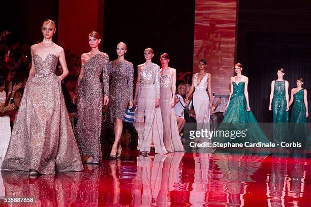 Models walk the runway during the Elie Saab show as part of Paris Fashion Week Haute-Couture Fall/Winter 2013-2014 at Palais Brongniart on July 3 in...