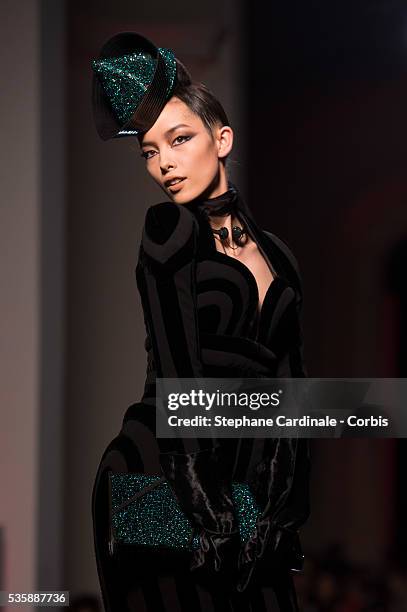 Model walks the runway during the Jean Paul Gaultier show as part of Paris Fashion Week Haute-Couture Fall/Winter 2013-2014, on July 3 in Paris