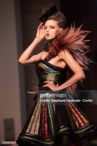 Model walks the runway during the Jean Paul Gaultier show as part of Paris Fashion Week Haute-Couture Fall/Winter 2013-2014, on July 3 in Paris