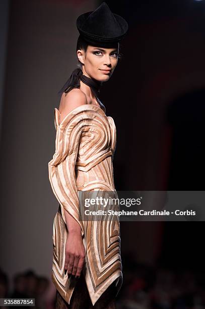 Model walks the runway during the Jean Paul Gaultier show as part of Paris Fashion Week Haute-Couture Fall/Winter 2013-2014, on July 3 in Paris