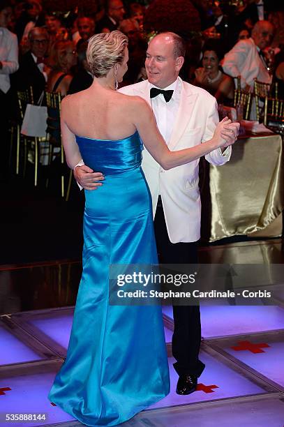 Princess Charlene of Monaco and Prince Albert II of Monaco dance during the 65th Monaco Red Cross Ball Gala at Sporting in Monaco.
