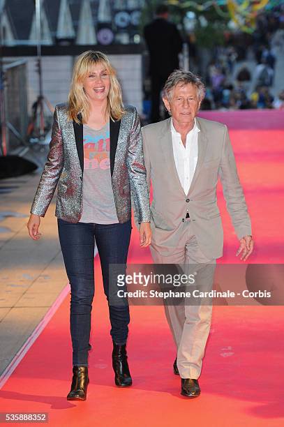Director Roman Polanski and wife Emmanuelle Seigner attend the 'Blue Jasmine' Paris premiere at UGC Cine Cite Bercy on August 27, 2013 in Paris